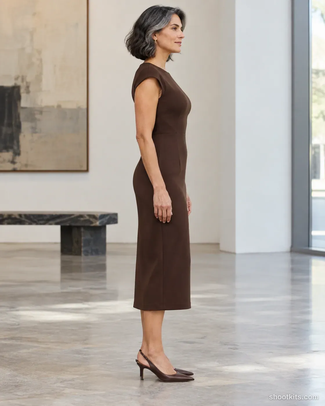 Gallery profile: dress photo made with ChatGPT. Neutral contemporary gallery.